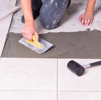 Applying Tile Adhesive for Installation | Carpets of Dalton