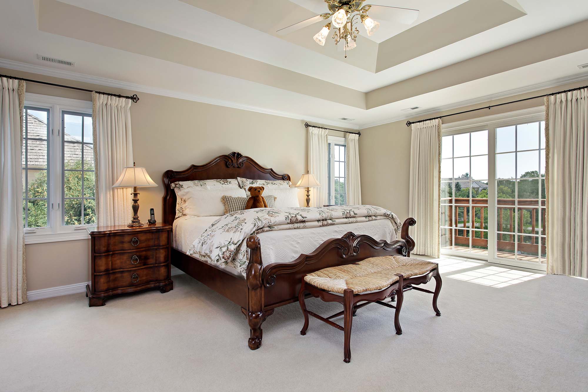 Soft beige carpet flooring in a spacious bedroom