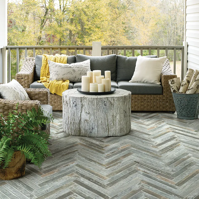 Tile on outdoor porch with lovely sitting area with candles