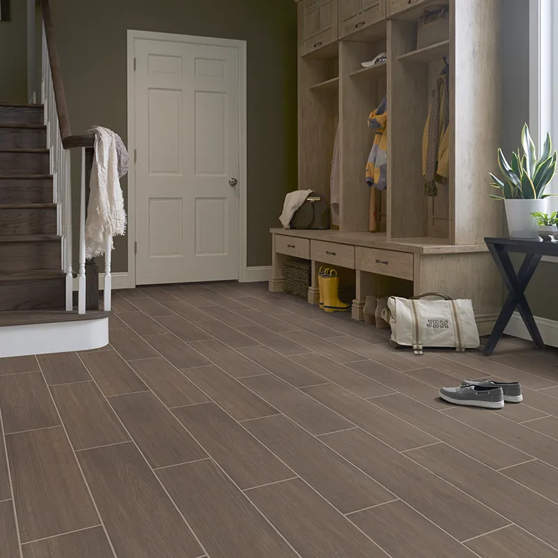 Tile floor in foyer of house with sitting show bench