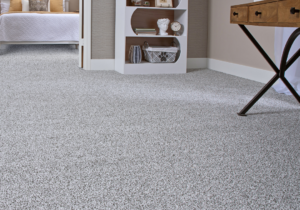 Light gray carpet flooring in a modern bedroom